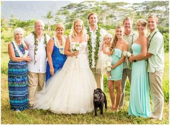 Bethany Hamilton with family at her Kauai wedding in a strapless tulle ball gown