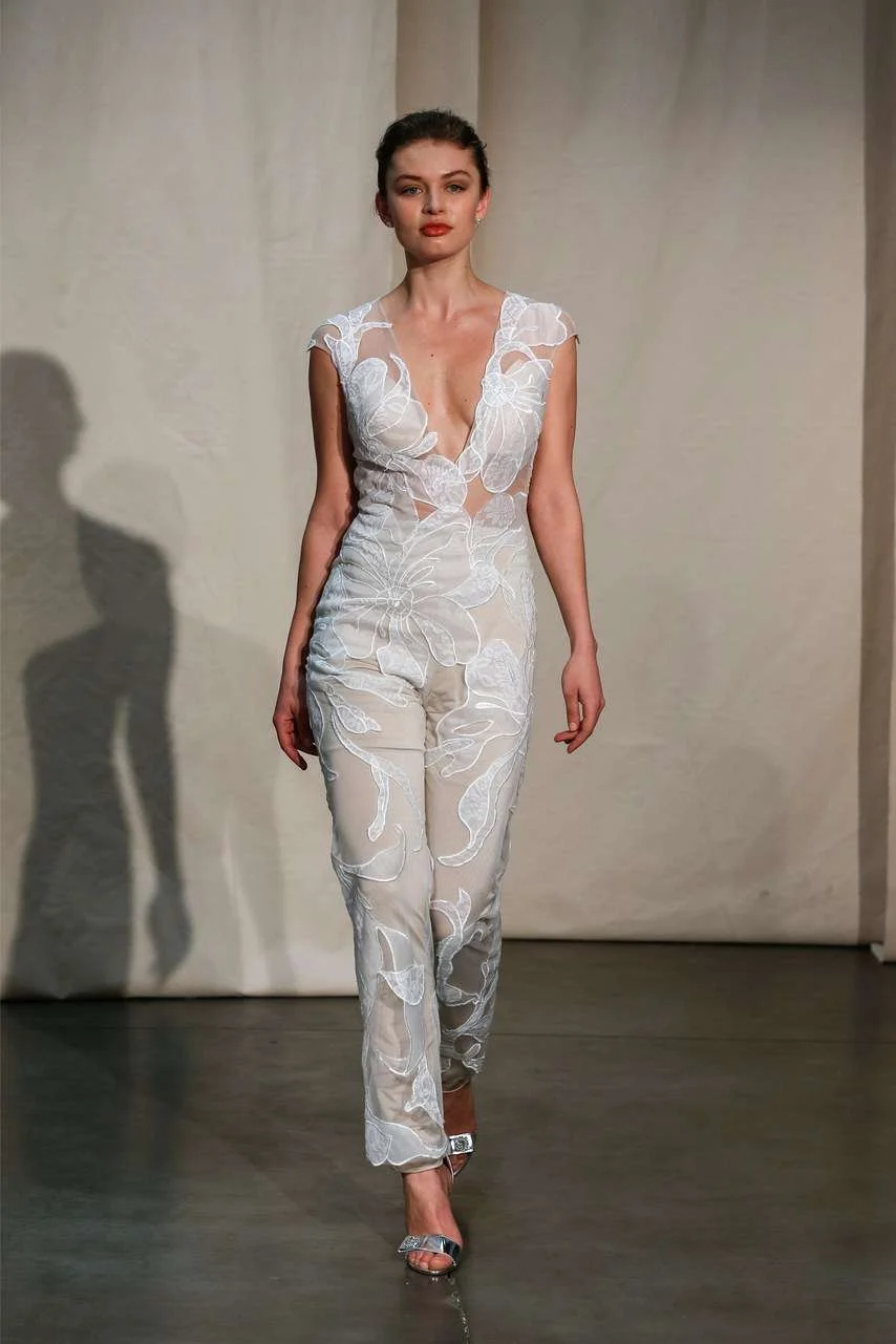 Justin Alexander Spring 2020 lace bridal jumpsuit with a plunging neckline